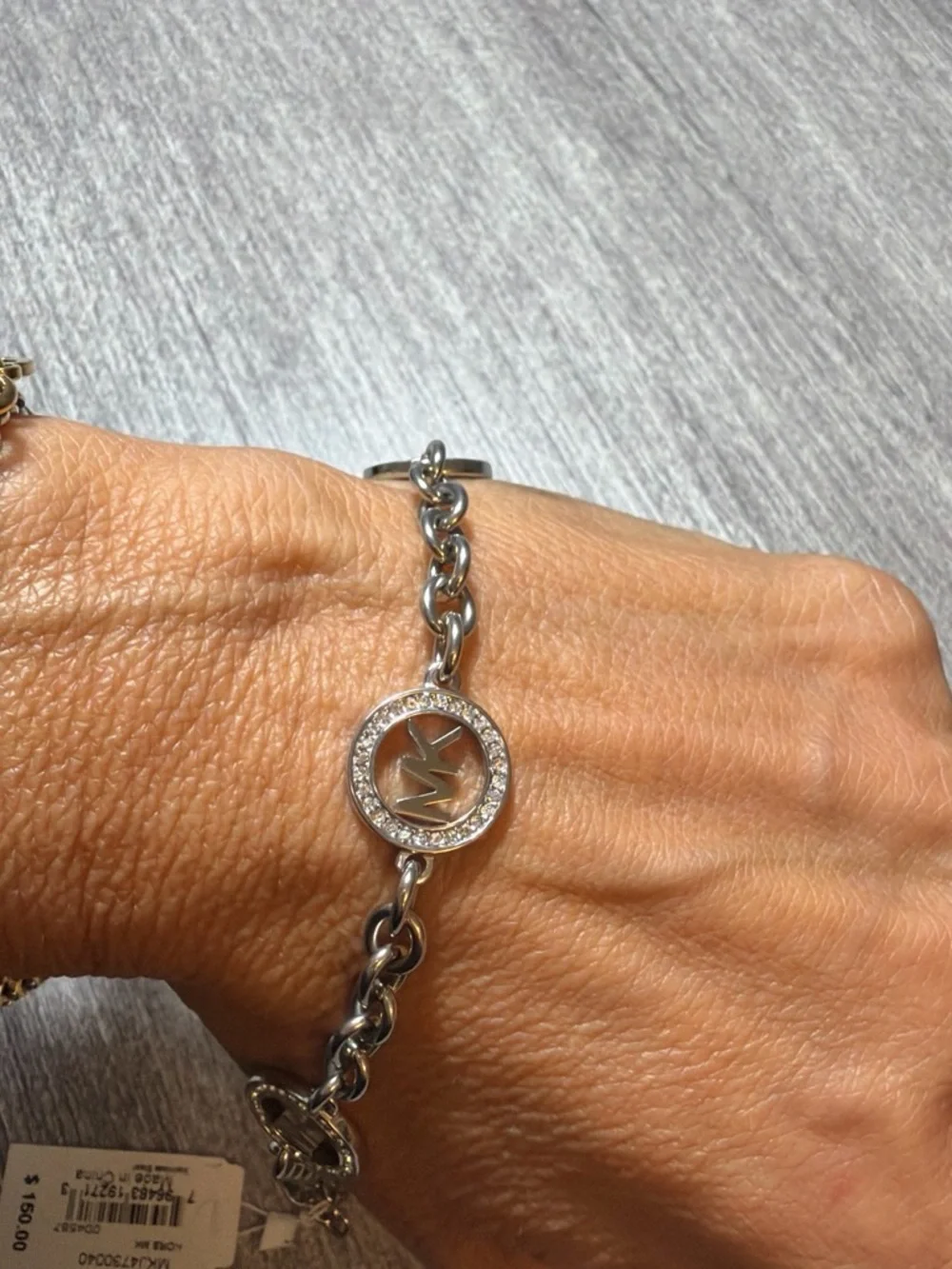 Michael Kors Silver-Tone MK Charm Chain Bracelet with Crystal Rings